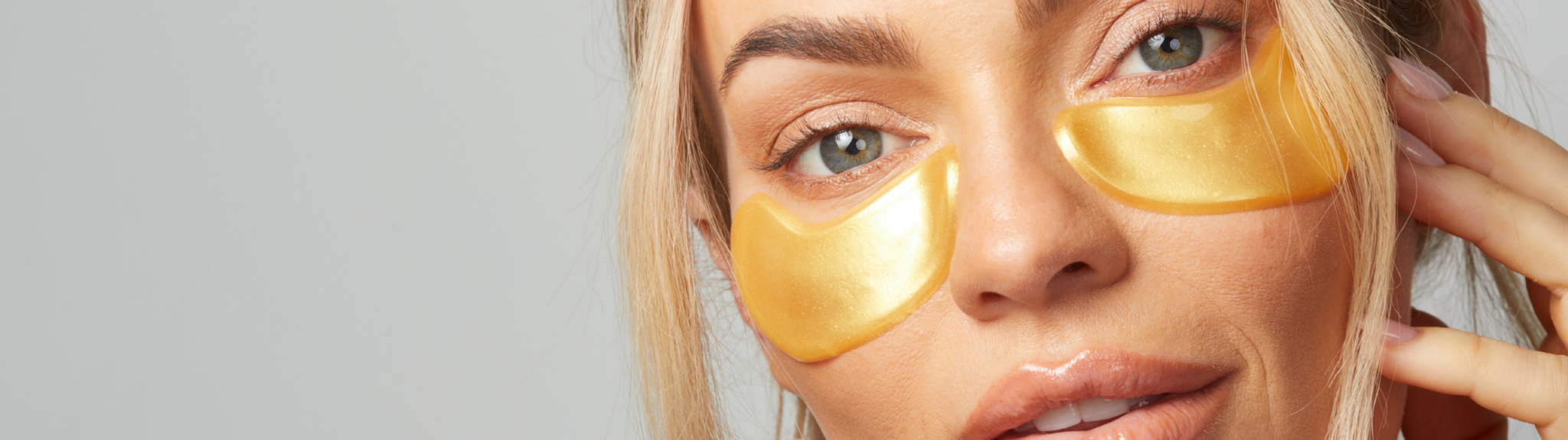 Woman wearing gold under-eye masks